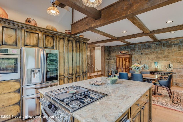 606 Dorais Way, Redstone, CO 81623 - kitchen featuring stainless steel appliances, beam ceiling, light stone counters, a center island, and recessed lighting