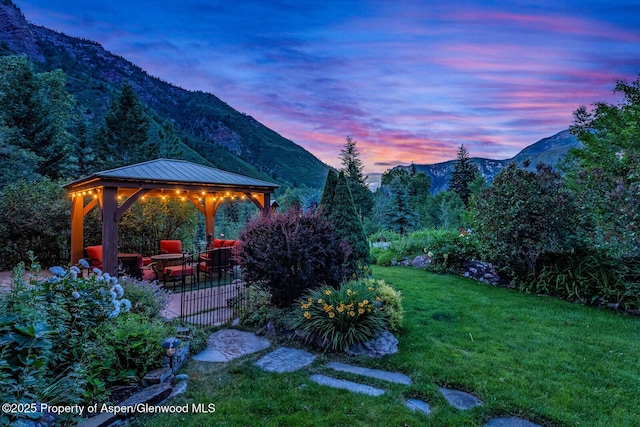 606 Dorais Way, Redstone, CO 81623 - yard at dusk featuring a mountain view, a gazebo, and a yard