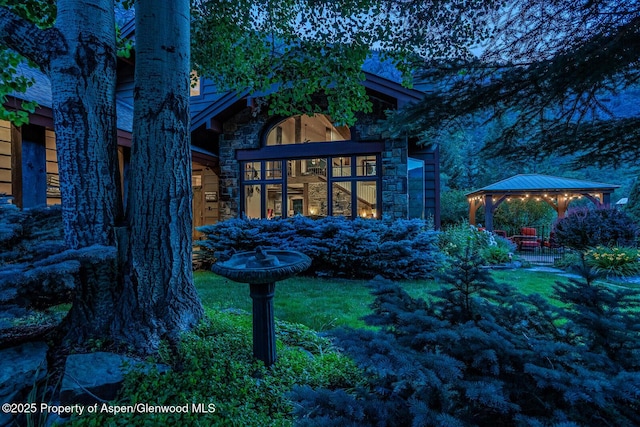 606 Dorais Way, Redstone, CO 81623 - view of side of home with stone siding and a gazebo