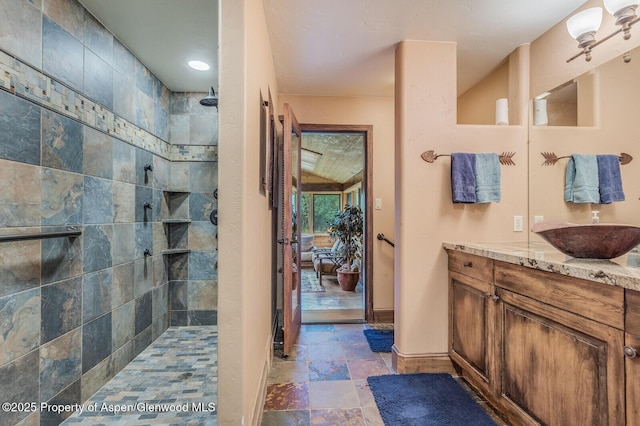 606 Dorais Way, Redstone, CO 81623 - full bathroom with stone finish floors, walk in shower, and vanity
