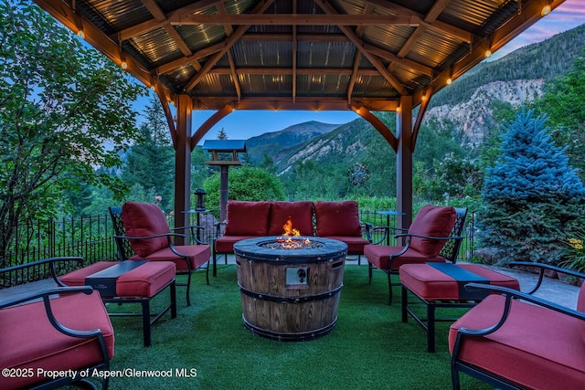 606 Dorais Way, Redstone, CO 81623 - view of patio featuring a mountain view, a gazebo, and an outdoor living space with a fire pit