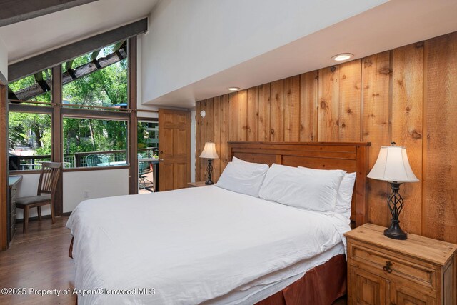 979 Queen St, Aspen, CO 81611 - bedroom with wood walls and wood finished floors