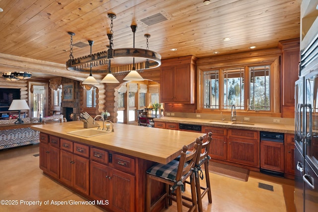 kitchen with wooden ceiling, log walls, wooden counters, and a sink