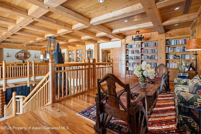 sitting room featuring recessed lighting, wooden ceiling, an upstairs landing, beamed ceiling, and wood-type flooring