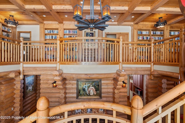 interior space featuring an inviting chandelier, wooden ceiling, beam ceiling, and recessed lighting