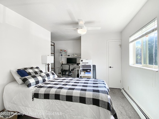 bedroom with baseboard heating, a ceiling fan, and carpet