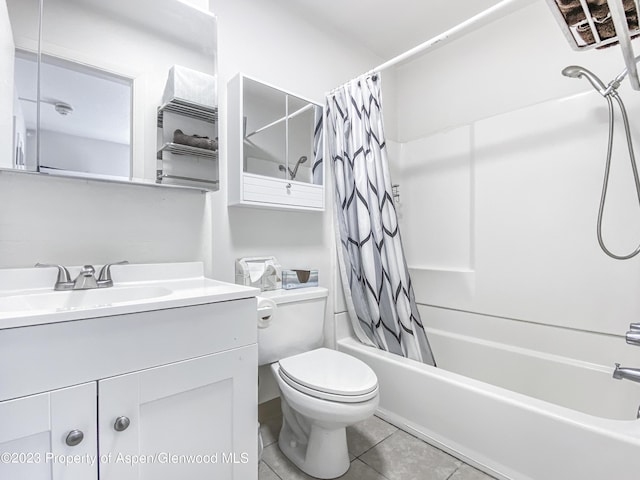 bathroom with tile patterned floors, shower / bath combo with shower curtain, toilet, and vanity