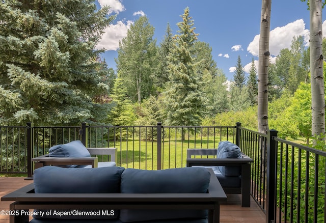 65 Harleston Grn Unit 51, Snowmass Village, CO 81615 - wooden deck with a lawn