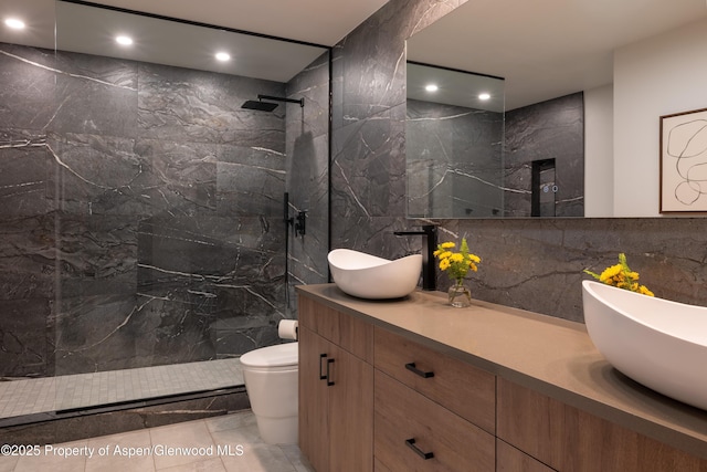 65 Harleston Grn Unit 51, Snowmass Village, CO 81615 - full bathroom featuring tile walls, a marble finish shower, double vanity, and recessed lighting