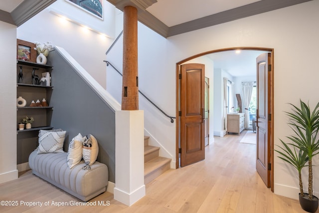 65 Harleston Grn Unit 51, Snowmass Village, CO 81615 - stairs featuring wood finished floors, arched walkways, and ornamental molding