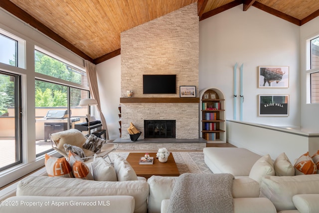 65 Harleston Grn Unit 51, Snowmass Village, CO 81615 - living room with a wooden ceiling with exposed beams, wood finished floors, high vaulted ceiling, plenty of natural light, and a stone fireplace
