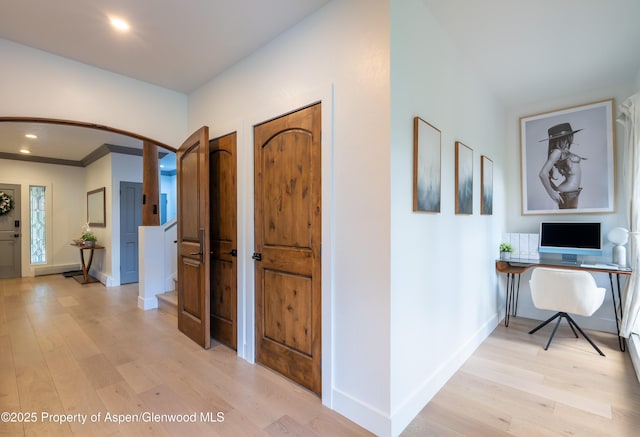 65 Harleston Grn Unit 51, Snowmass Village, CO 81615 - entrance foyer featuring arched walkways, light wood finished floors, and recessed lighting