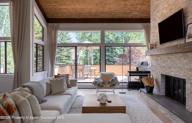65 Harleston Grn Unit 51, Snowmass Village, CO 81615 - living room with healthy amount of natural light, a fireplace, wooden ceiling, and wood finished floors