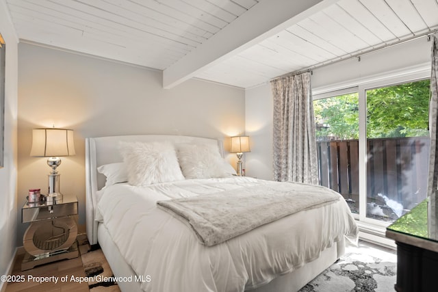 630 E Cooper Ave Unit 4, Aspen, CO 81611 - bedroom featuring access to exterior, a baseboard heating unit, wooden ceiling with exposed beams, and wood finished floors