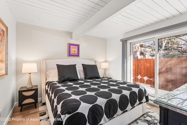 630 E Cooper Ave Unit 4, Aspen, CO 81611 - bedroom featuring wood finished floors and wooden ceiling with exposed beams
