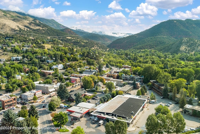 birds eye view of property with a mountain view