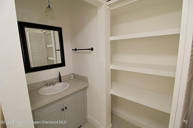 bathroom featuring tile patterned flooring and vanity