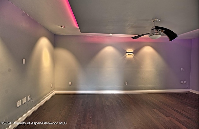 unfurnished room featuring dark hardwood / wood-style floors and ceiling fan