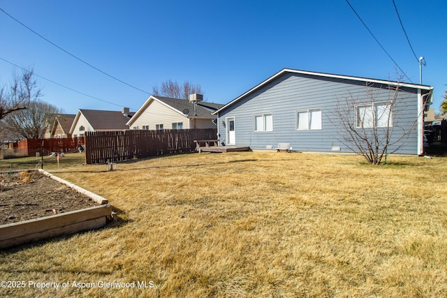 exterior space featuring a wooden deck and fence