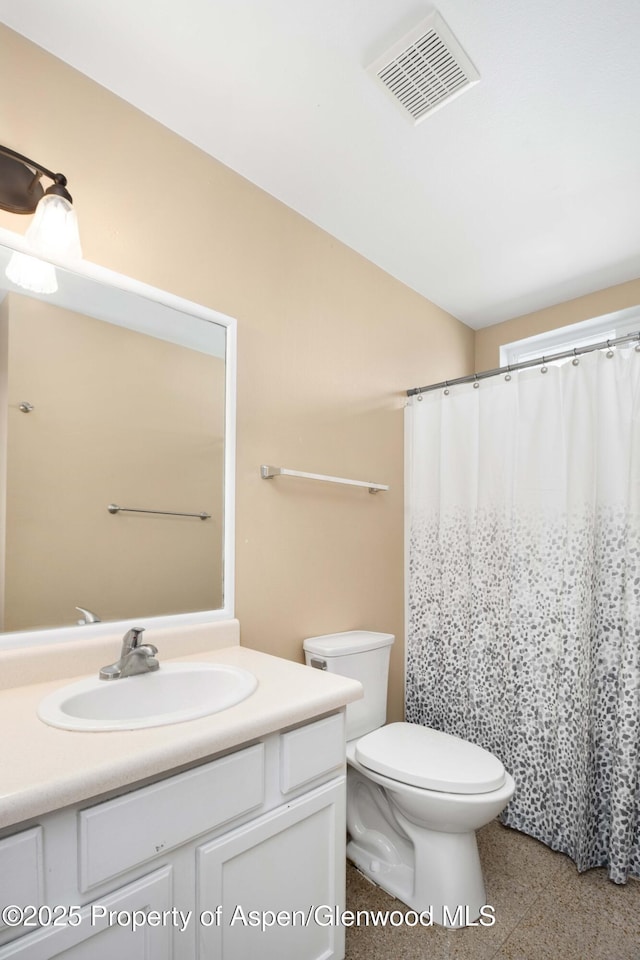 272 Birch Ct, Silt, CO 81652 - bathroom with visible vents, toilet, vanity, and a shower with curtain