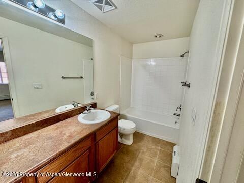 612 River View Dr Unit 804, New Castle, CO 81647 - full bathroom with vanity, tile patterned flooring, shower / tub combination, and a baseboard heating unit