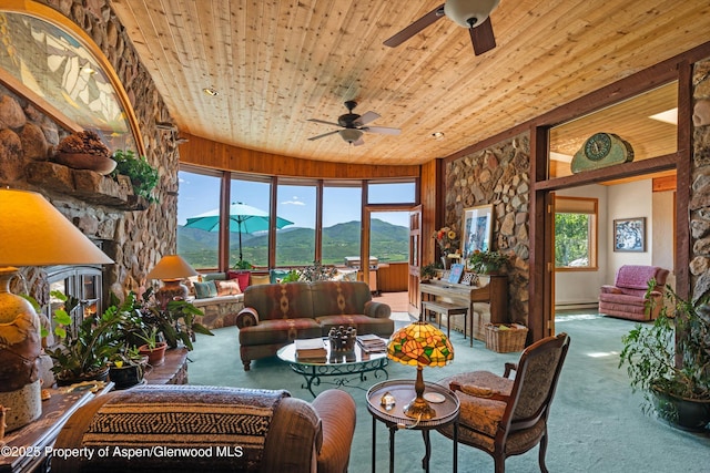 1789 Medicine Bow Rd, Aspen, CO 81611 - carpeted living area featuring a mountain view, ceiling fan, and wooden ceiling
