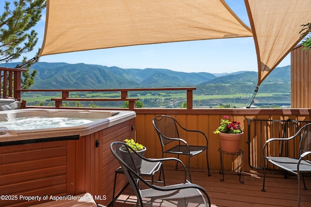 1789 Medicine Bow Rd, Aspen, CO 81611 - wooden terrace with a hot tub and a mountain view