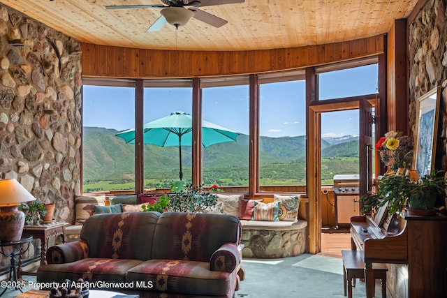 1789 Medicine Bow Rd, Aspen, CO 81611 - sunroom / solarium featuring wooden ceiling, a mountain view, carpet floors, and wooden walls