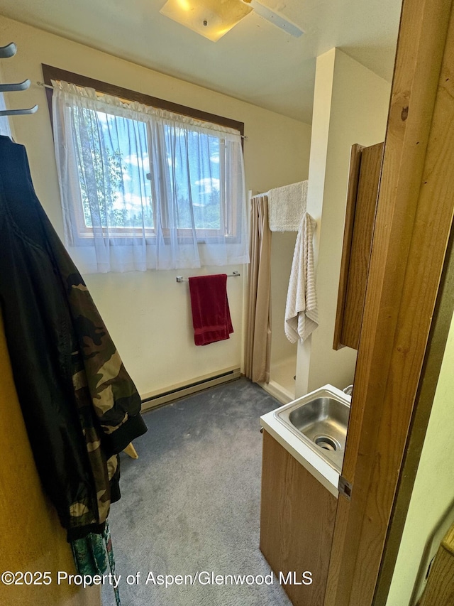 1789 Medicine Bow Rd, Aspen, CO 81611 - bathroom with a baseboard radiator and vanity