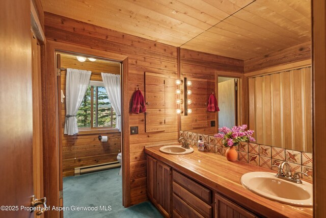 1789 Medicine Bow Rd, Aspen, CO 81611 - full bath with a baseboard radiator, double vanity, wood walls, and wood ceiling