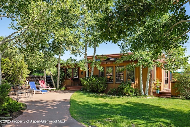 1789 Medicine Bow Rd, Aspen, CO 81611 - view of community featuring a yard, a patio area, and a wooden deck