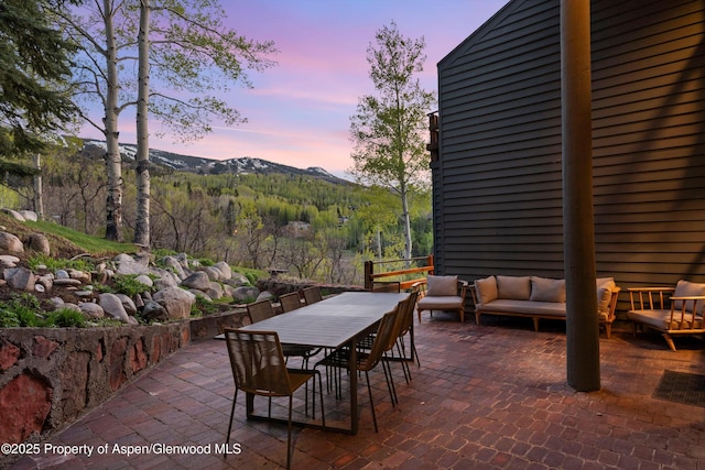 172 Deer Ridge Ln, Snowmass Village, CO 81615 - view of patio / terrace with an outdoor hangout area, a mountain view, and outdoor dining area