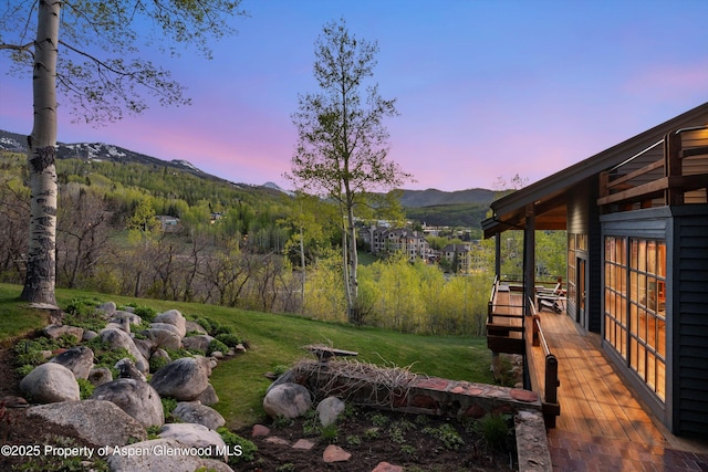 172 Deer Ridge Ln, Snowmass Village, CO 81615 - yard at dusk featuring a mountain view and a yard