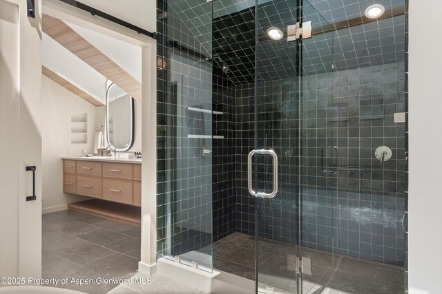 172 Deer Ridge Ln, Snowmass Village, CO 81615 - full bath featuring vanity, a stall shower, tile patterned floors, and baseboards