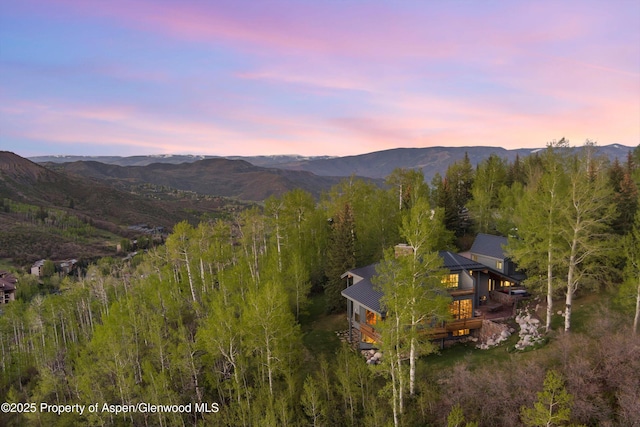 172 Deer Ridge Ln, Snowmass Village, CO 81615 - aerial view at dusk of a mountain view and a wooded view