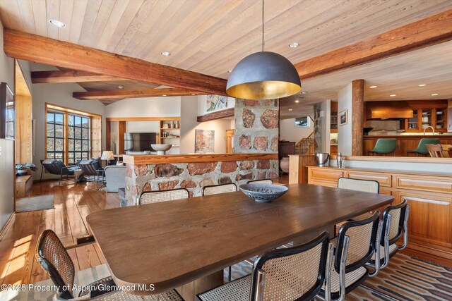 172 Deer Ridge Ln, Snowmass Village, CO 81615 - dining room with hardwood / wood-style floors, recessed lighting, beamed ceiling, and built in shelves