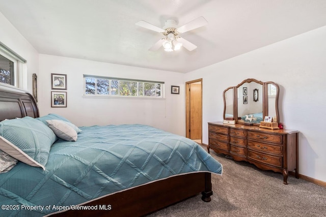 carpeted bedroom with baseboards and ceiling fan
