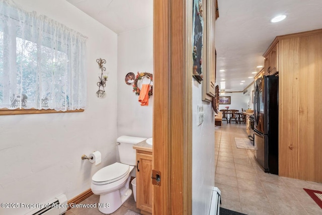 bathroom featuring tile patterned floors, a baseboard radiator, a baseboard heating unit, toilet, and recessed lighting