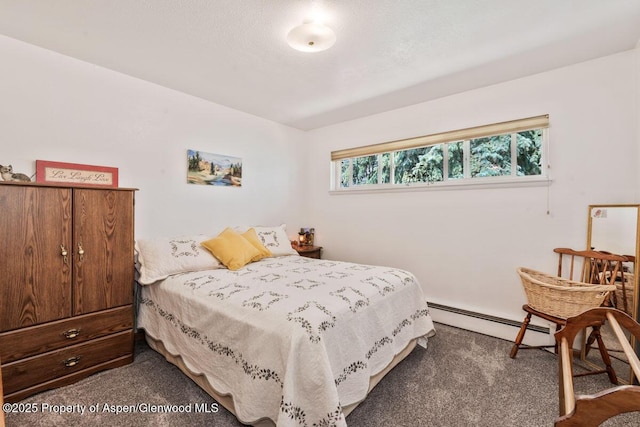 carpeted bedroom with a baseboard radiator