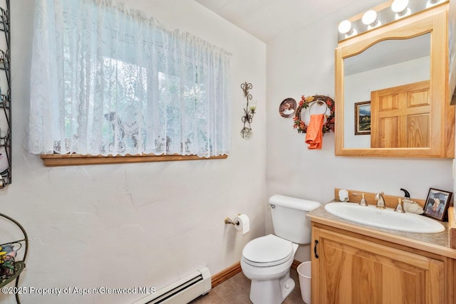 bathroom featuring vanity, tile patterned floors, and toilet
