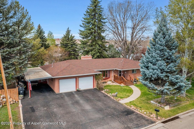 ranch-style house with a front lawn, aphalt driveway, fence, a chimney, and an attached garage