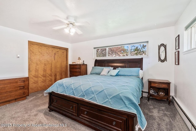 carpeted bedroom featuring a closet, ceiling fan, and a baseboard heating unit