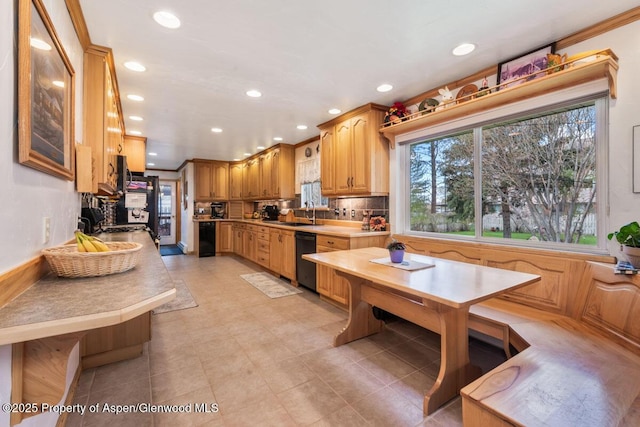 kitchen featuring light countertops, backsplash, recessed lighting, and dishwasher