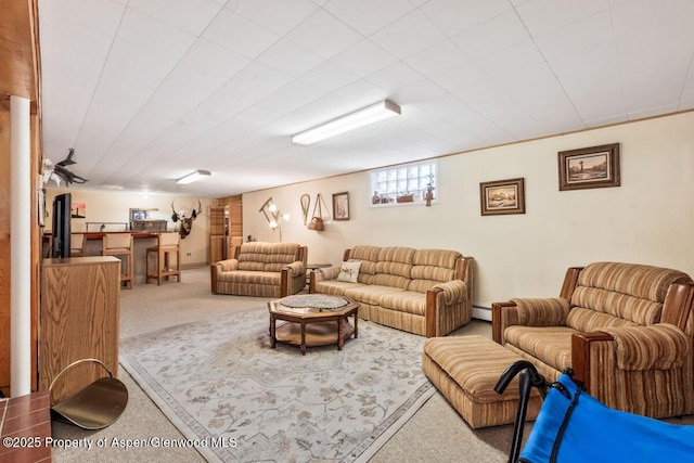 living room with carpet floors and baseboard heating