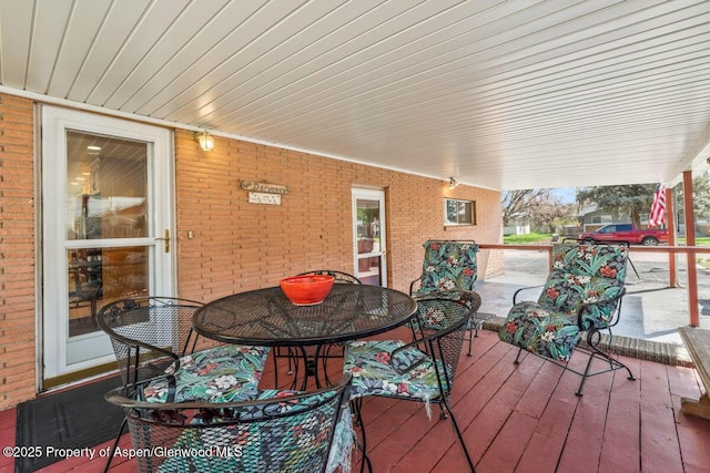wooden deck with outdoor dining area