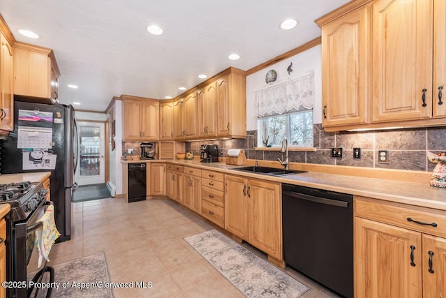 kitchen featuring crown molding, a sink, black appliances, and light brown cabinets