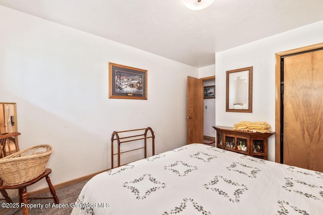 carpeted bedroom with baseboards