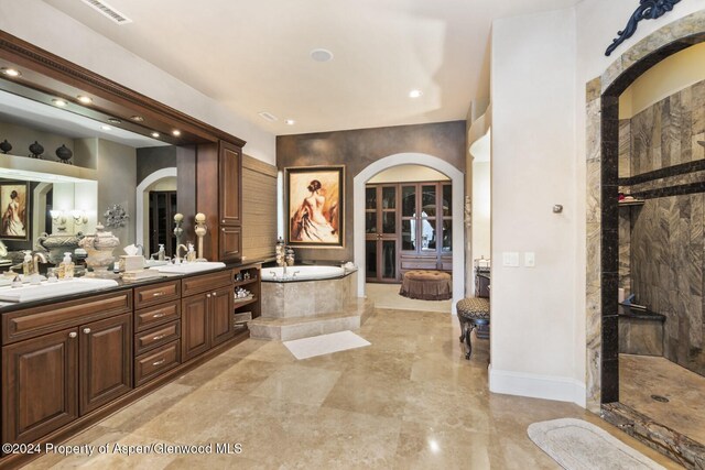 bathroom with separate shower and tub and vanity