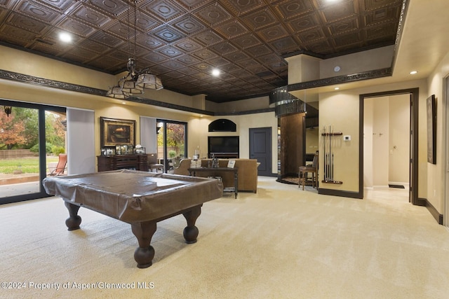 game room featuring light carpet, a high ceiling, and billiards