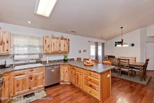 2939 Jon Hall Rd, Grand Junction, CO 81503 - kitchen featuring stainless steel dishwasher, a sink, a chandelier, vaulted ceiling, and a peninsula